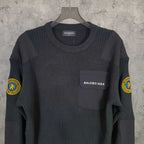 Balenciaga long-sleeve knit sweater front view with chest pocket and logo patch