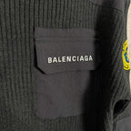 Balenciaga knit sweater chest pocket close-up with BALENCIAGA logo label
