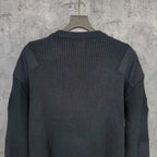 Balenciaga long-sleeve knit sweater back view with ribbed knit panels on hanger