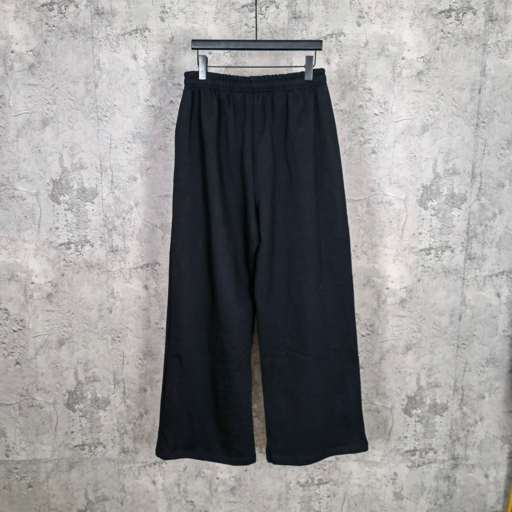 Balenciaga black wide-leg pants, relaxed fit, elastic waistband, clean front view