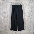 Balenciaga black wide-leg pants, relaxed fit, elastic waistband, clean front view