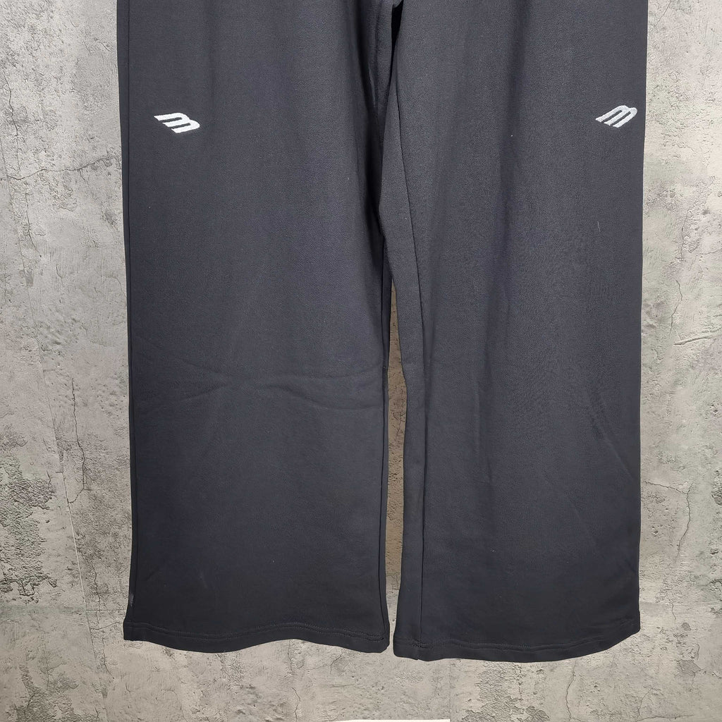 Balenciaga black wide-leg pants, straight hem detail and small side logo markings
