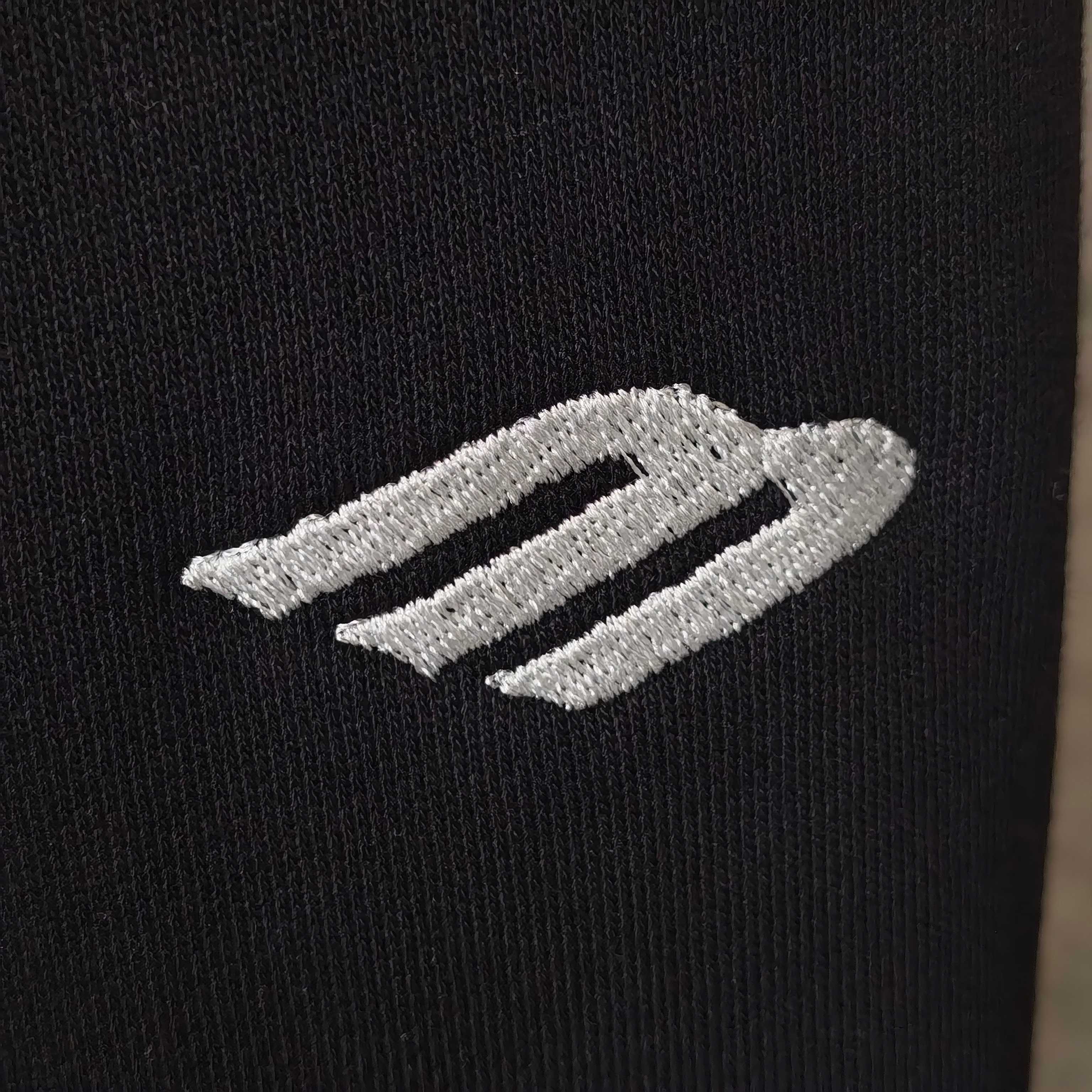 Balenciaga side stripe logo on black fabric, two light embroidered bands