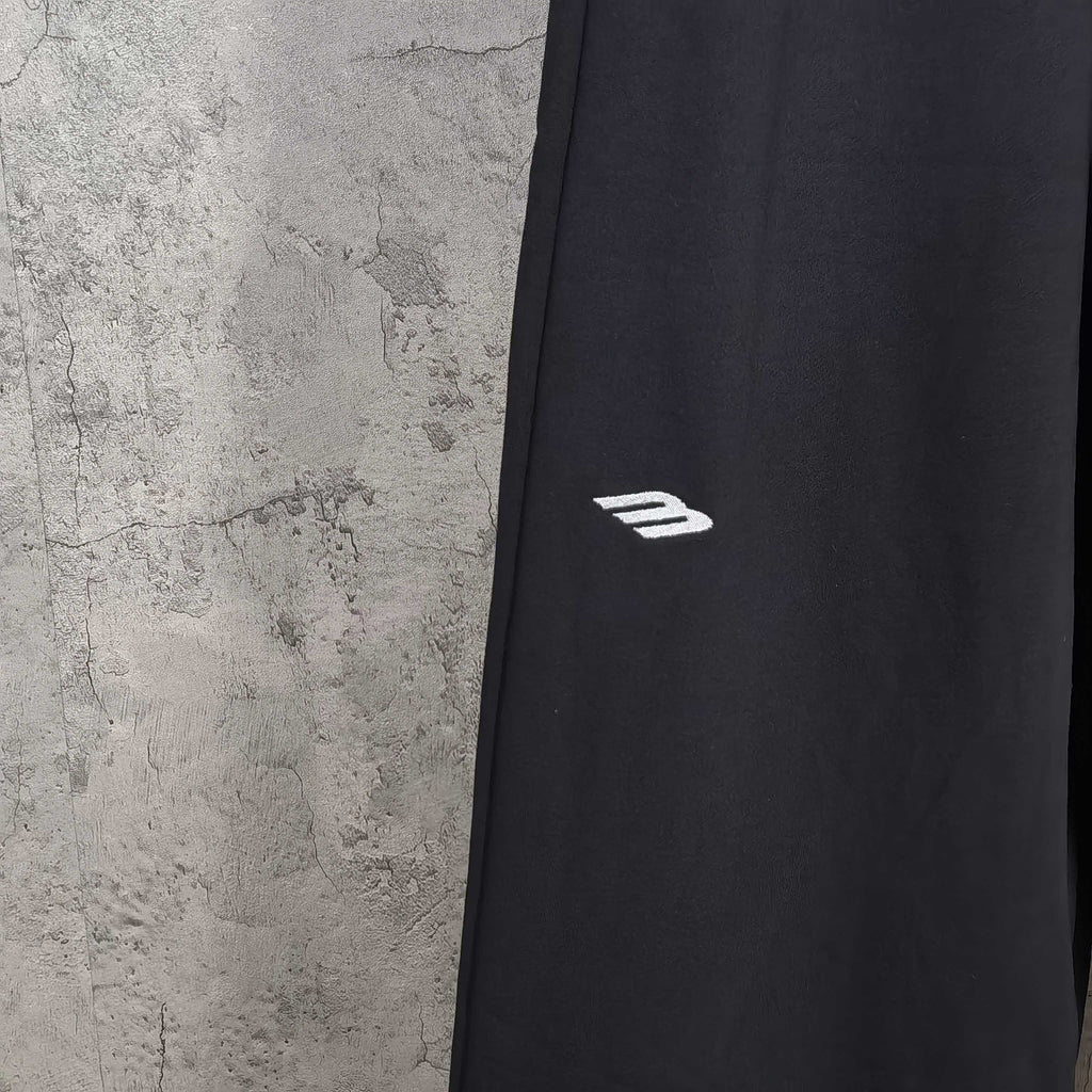 Balenciaga pants with side logo stripe, dark woven fabric, straight leg