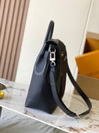 Louis Vuitton black leather handbag with side profile and adjustable shoulder strap