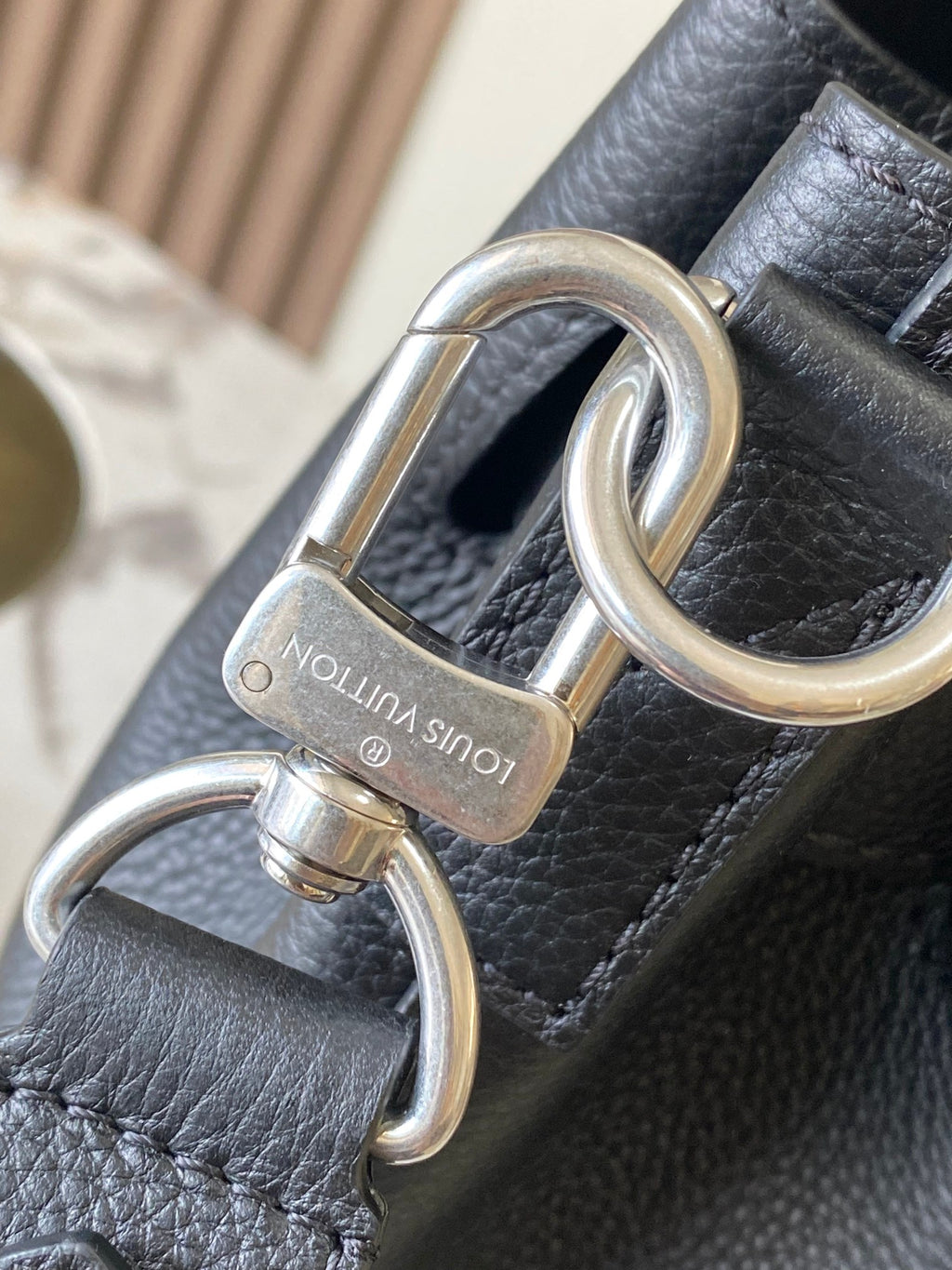 Louis Vuitton black leather handbag with silver key ring hardware and lock