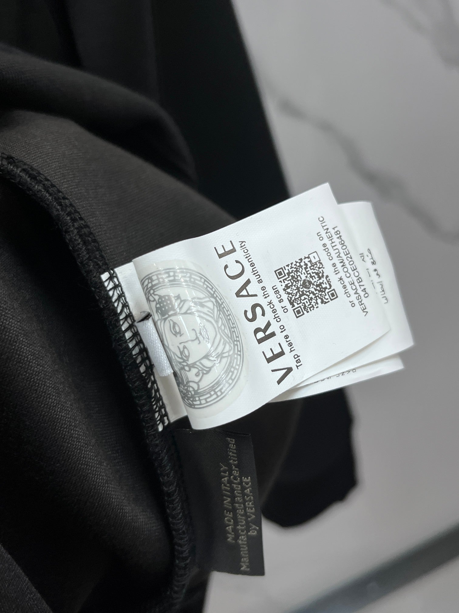 Versace crewneck sweatshirt fabric and size label on the inside neckline