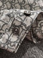 Logo-print jacket sleeve cuff with two round metal snap buttons