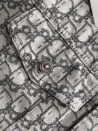 Logo-print jacket shoulder yoke detail with round metal snap button