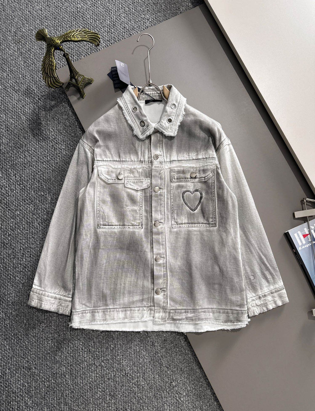 White denim dress with collared neckline, snap buttons, and heart patch pocket detail