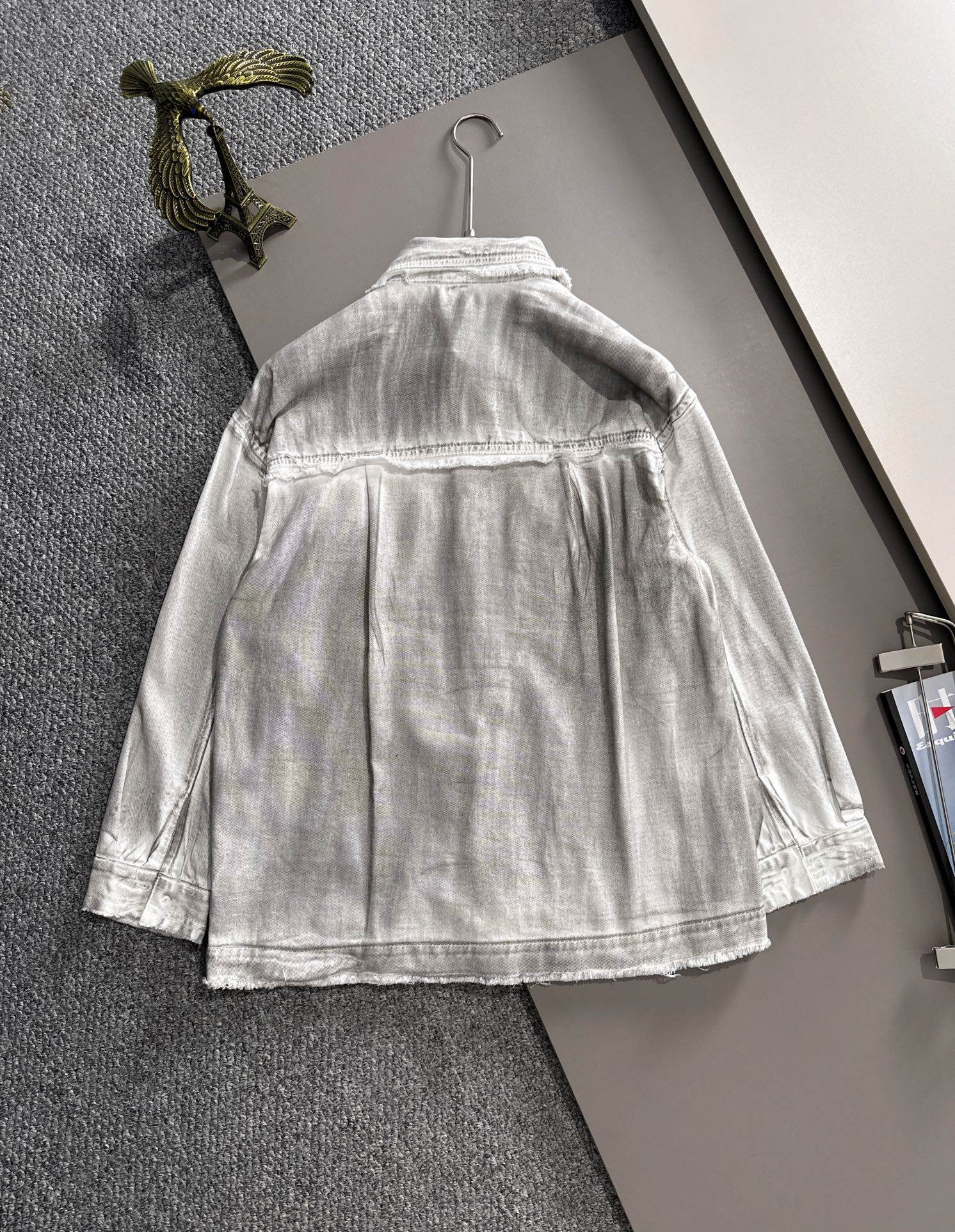 Back view of light denim dress with button placket and gathered skirt hem