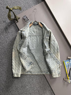 Light blue denim jacket on hanger with floral embroidery, button front, flap pockets