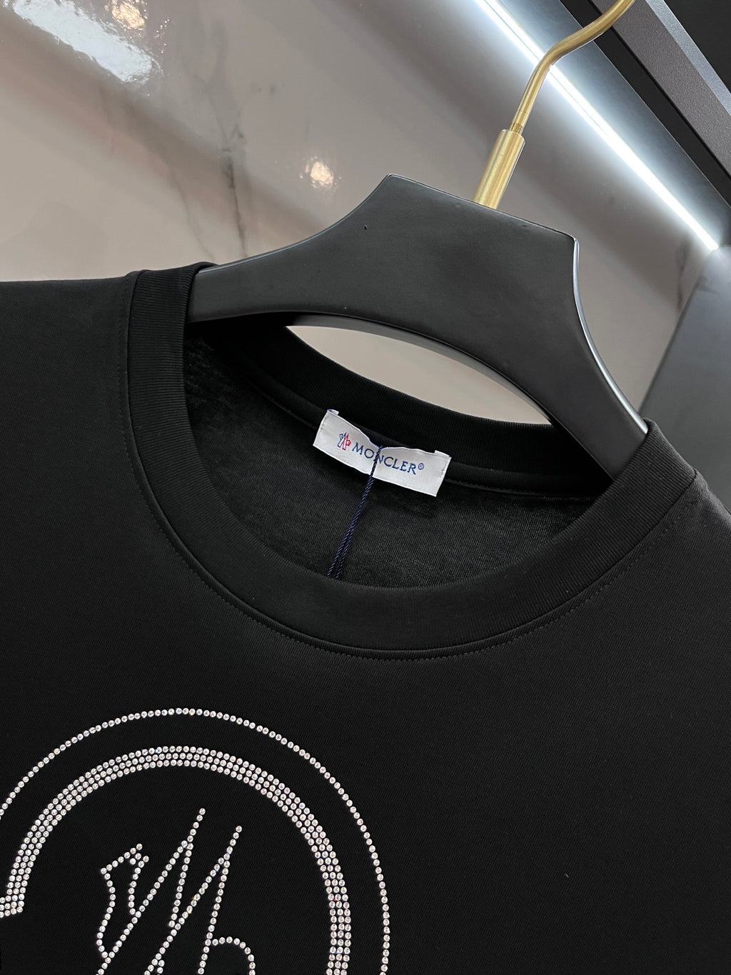 Black T-shirt neckline with inner neck label