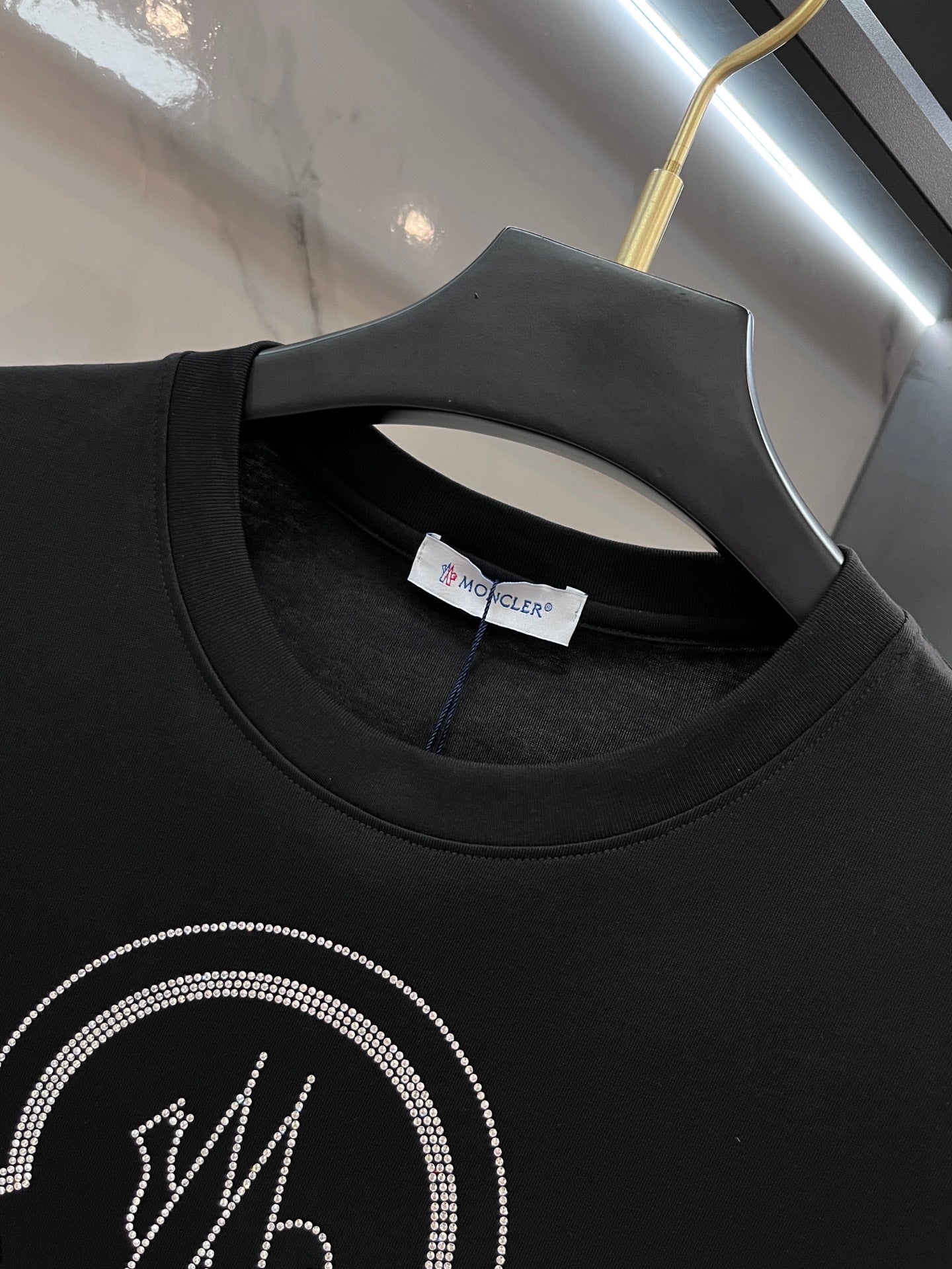 Black T-shirt neckline with inner neck label