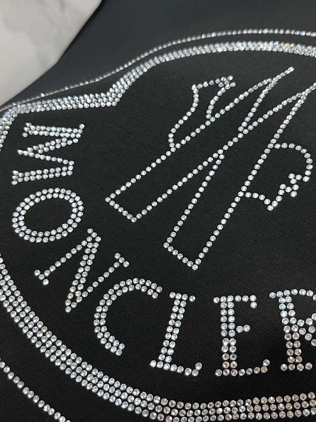 Black T-shirt with rhinestone letter logo detail