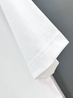 White T-shirt sleeve and side seam close-up