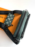 Louis Vuitton teal monogram belt bag style with black adjustable strap and dual zips