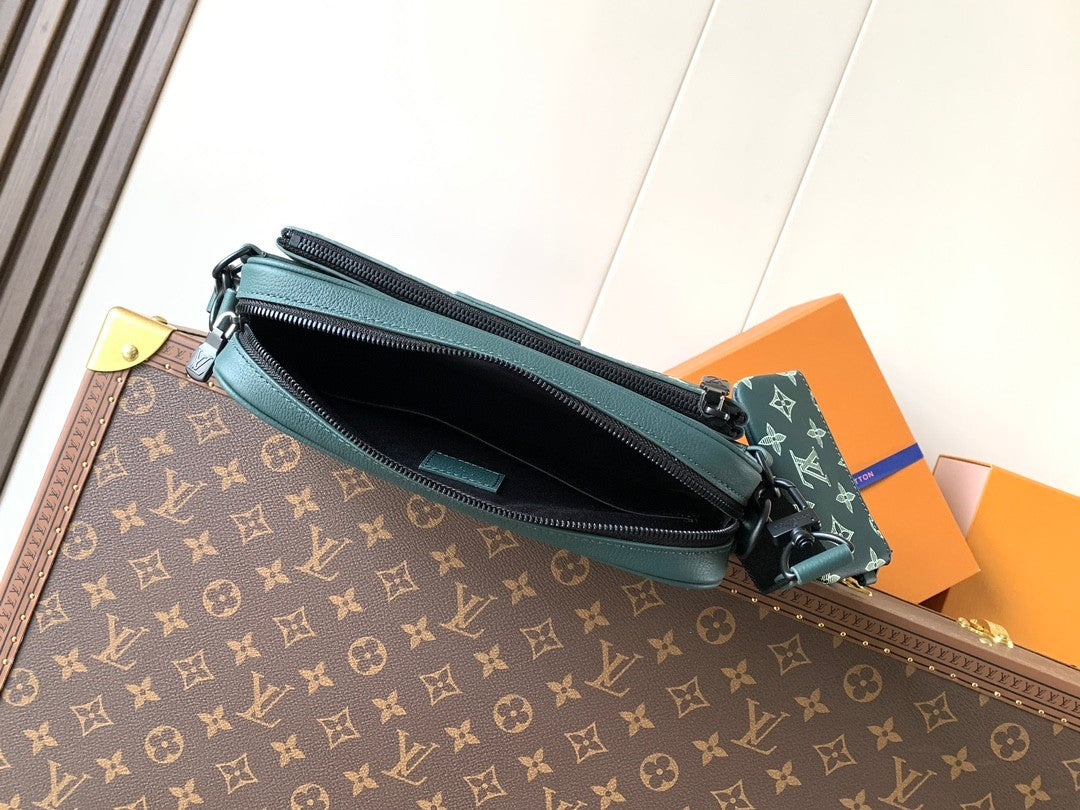Louis Vuitton monogram crossbody bag with front zipper pocket and teal trim