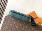 Louis Vuitton teal monogram bag with teal trim and black shoulder strap, front view