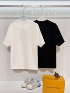 Dior short-sleeve T-shirts, white and black on hangers