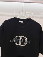 Black Dior crew-neck T-shirt with embroidered oval logo and 'Couture' text on chest