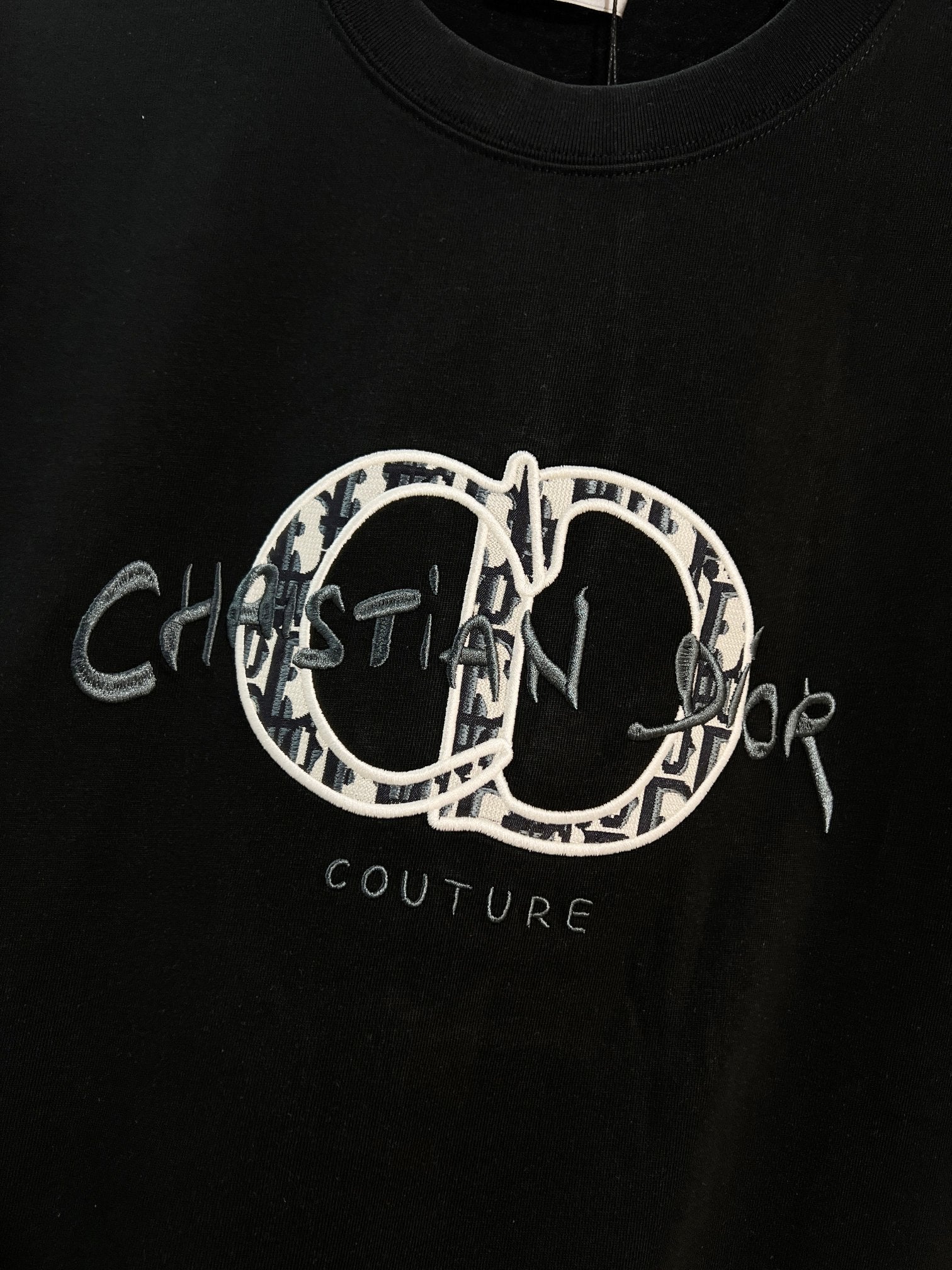 Black Dior T-shirt with large embroidered oval 'Couture' logo graphic