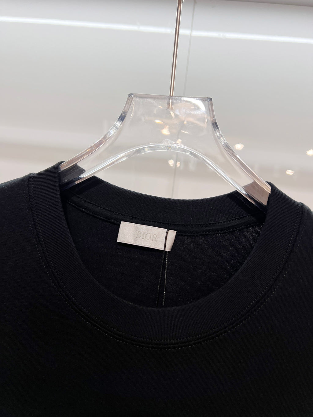 Black Dior T-shirt neckline detail with inner neck label