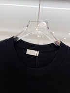 Black Dior T-shirt neckline detail with inner neck label