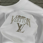 Close-up of white Louis Vuitton T-shirt with rhinestone LV logo on back