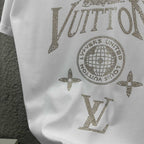 Close-up of white Louis Vuitton T-shirt rhinestone globe, stars, and LV lettering
