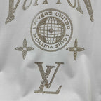 Close-up of white Louis Vuitton T-shirt rhinestone globe, stars, and LV letters