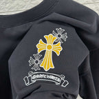 Dark T-shirt neckline and chest graphic: cross-flower with banner
