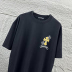 Dark T-shirt with small cross-flower graphic on left chest