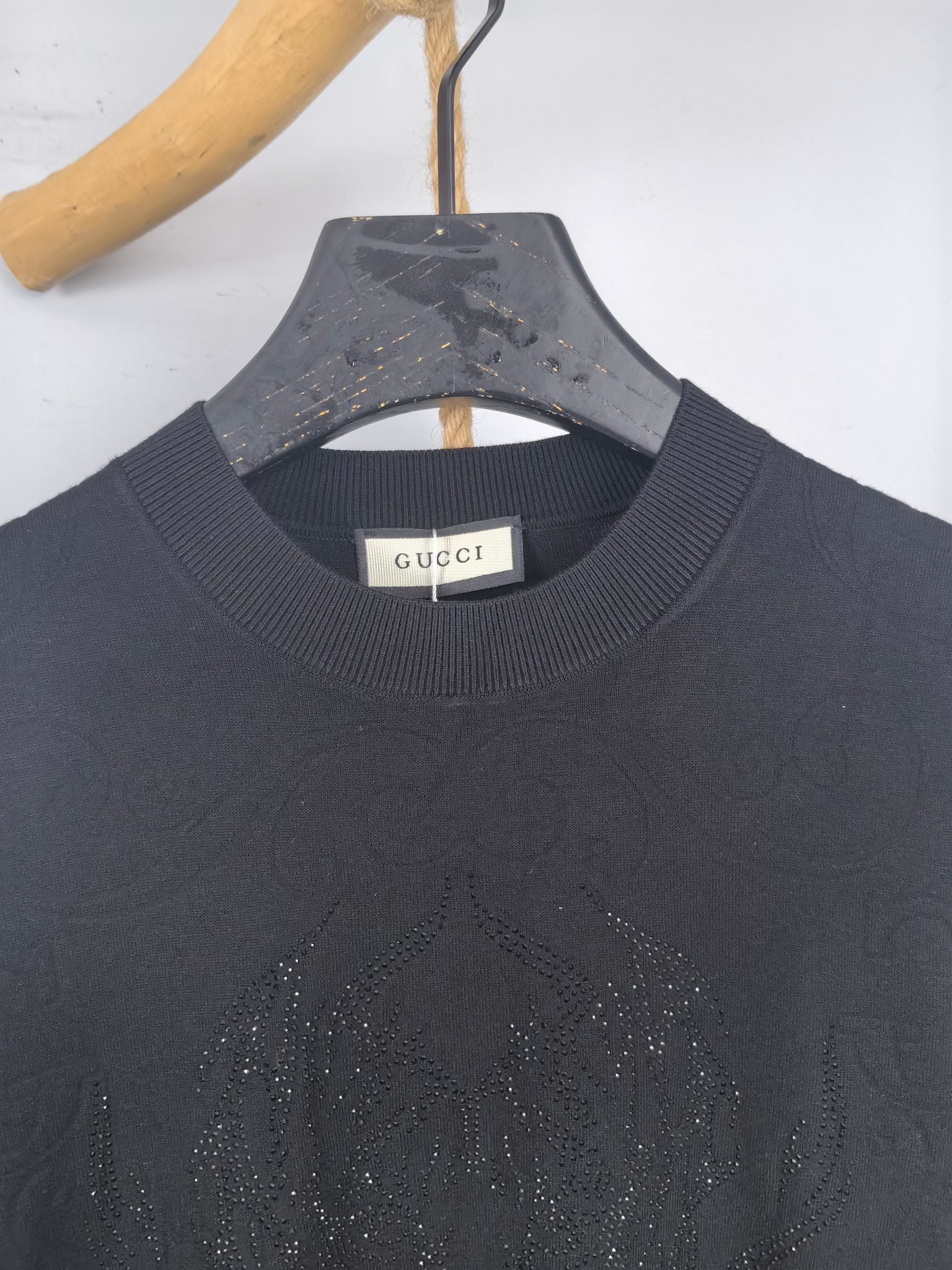 Gucci long-sleeve sweater neckline, dark ribbed collar with Gucci label