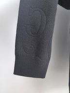 Gucci long-sleeve sweater hem and side, dark knit with embossed logo