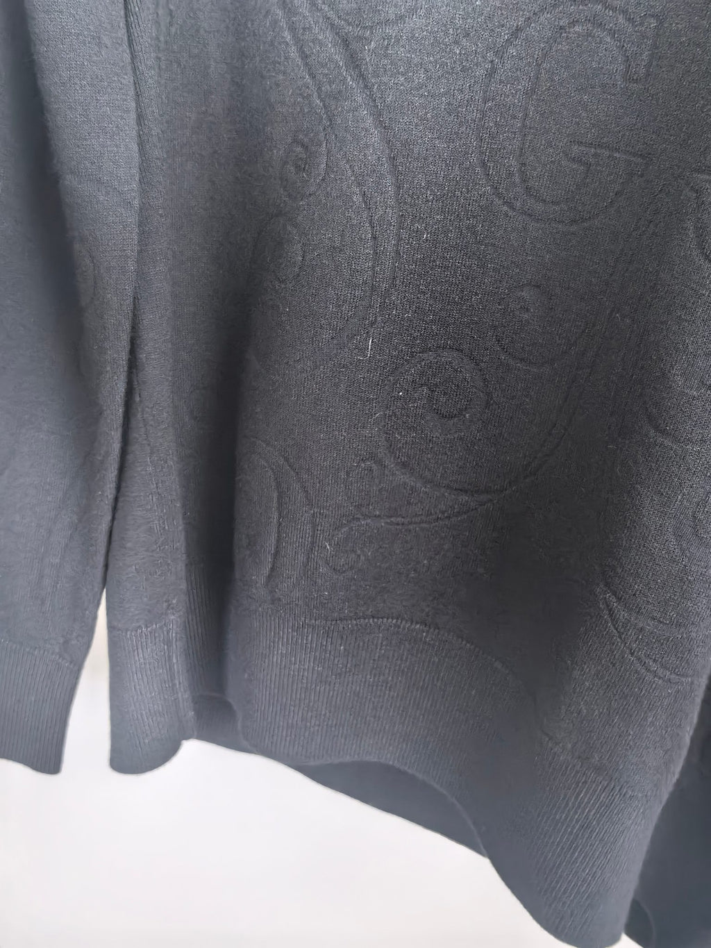Gucci long-sleeve sweater back detail, dark knit with raised logo emboss