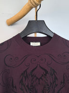 Gucci crewneck sweater neckline with Gucci label, dark plum and embroidered swirls