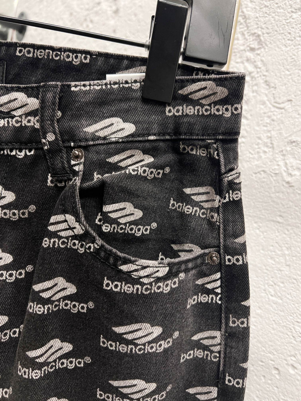 Balenciaga denim pocket and belt loops, logo pattern with stitched seams