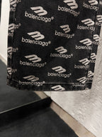 Balenciaga denim hem and pocket area, black with repeating logo print