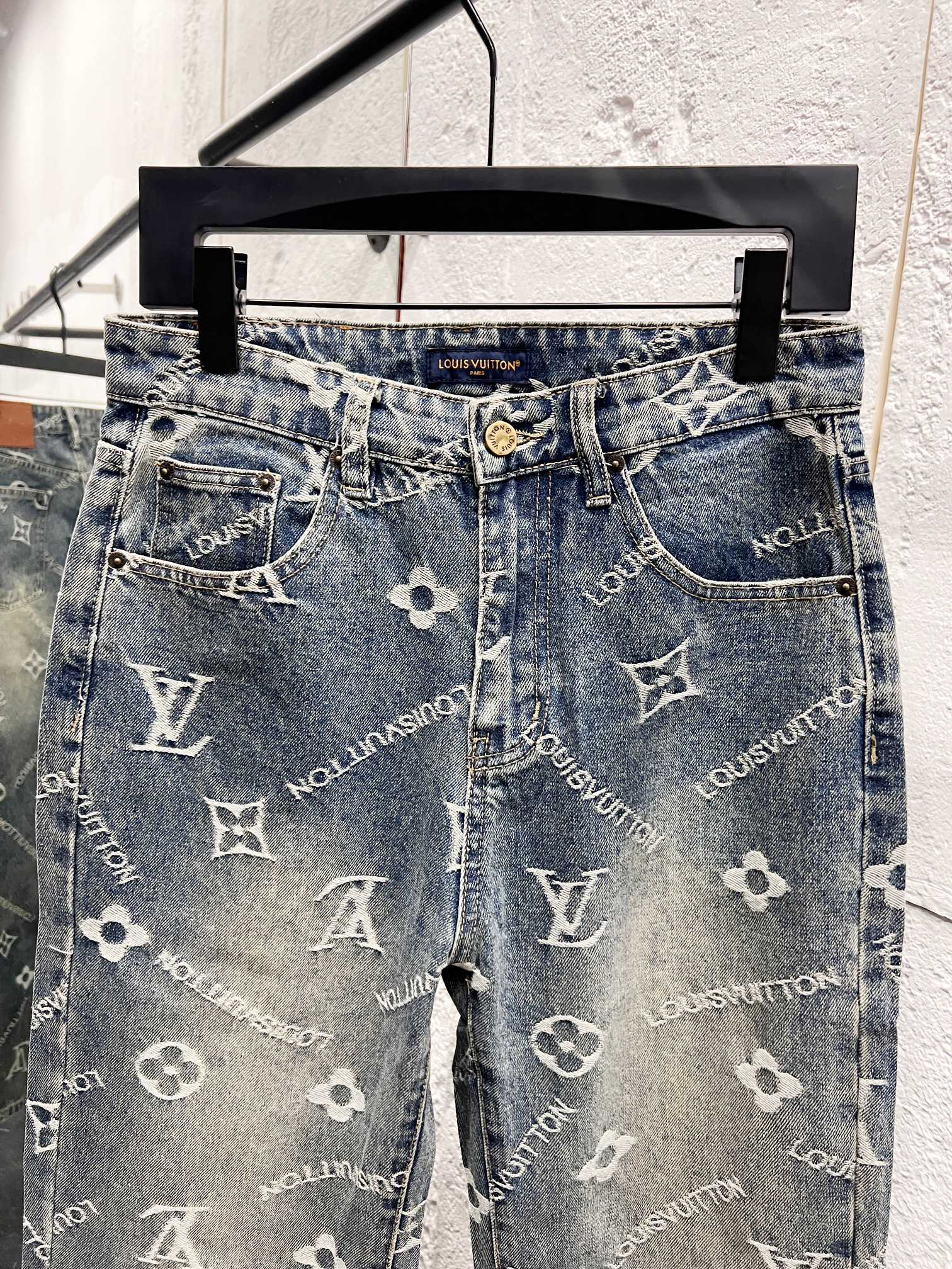 Light blue denim pants with allover white Louis Vuitton monogram pattern