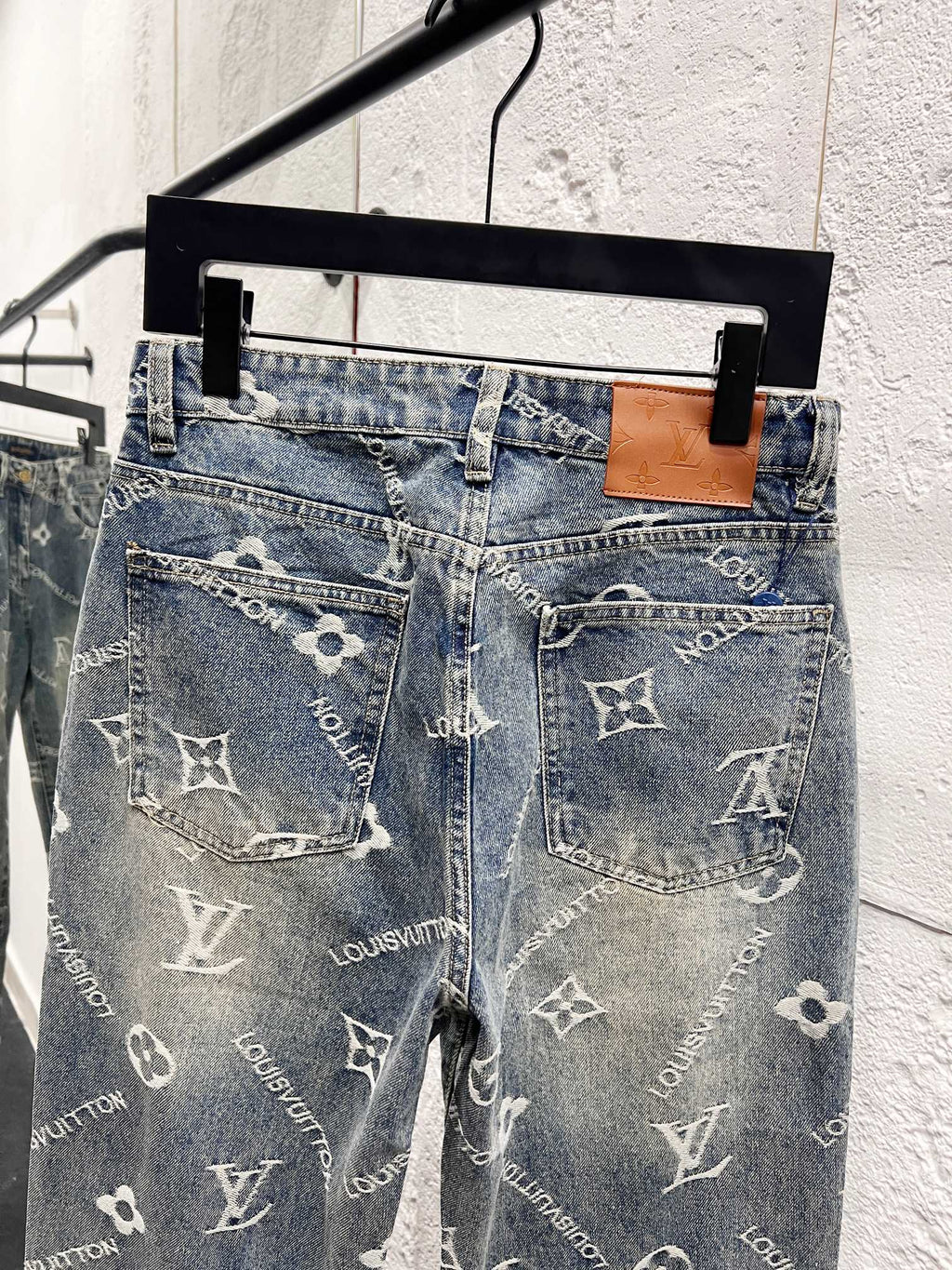 Light blue denim pants with front pockets and scattered white Louis Vuitton monogram