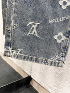 Denim pant hem with buttoned edge and white Louis Vuitton monogram motifs