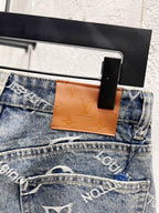Waist button and tan leather patch on light blue denim, Louis Vuitton monogram