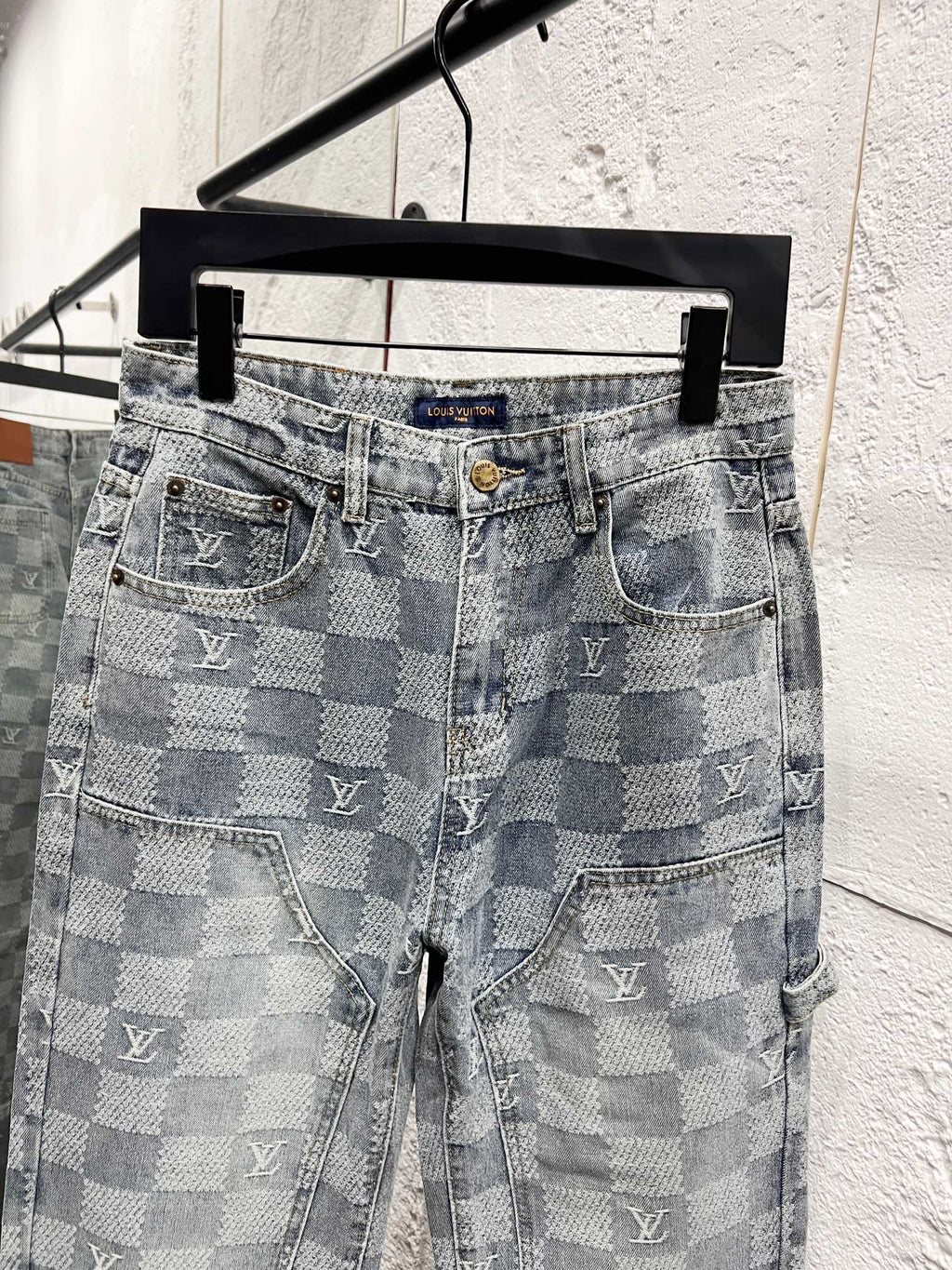 Louis Vuitton monogram jeans full front view with two front pockets and belt loops