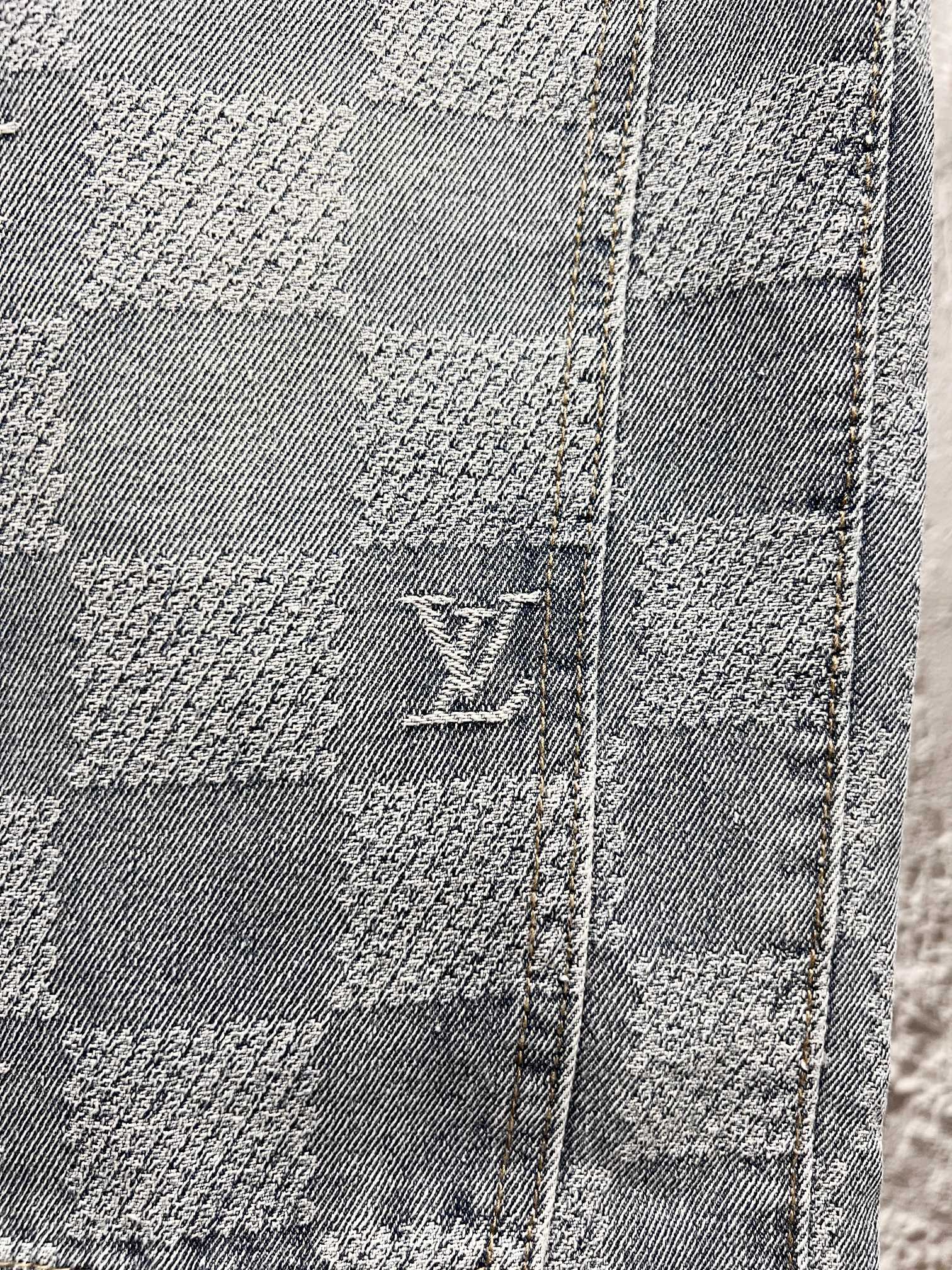 Louis Vuitton monogram denim close-up with stitched checker blocks and logo