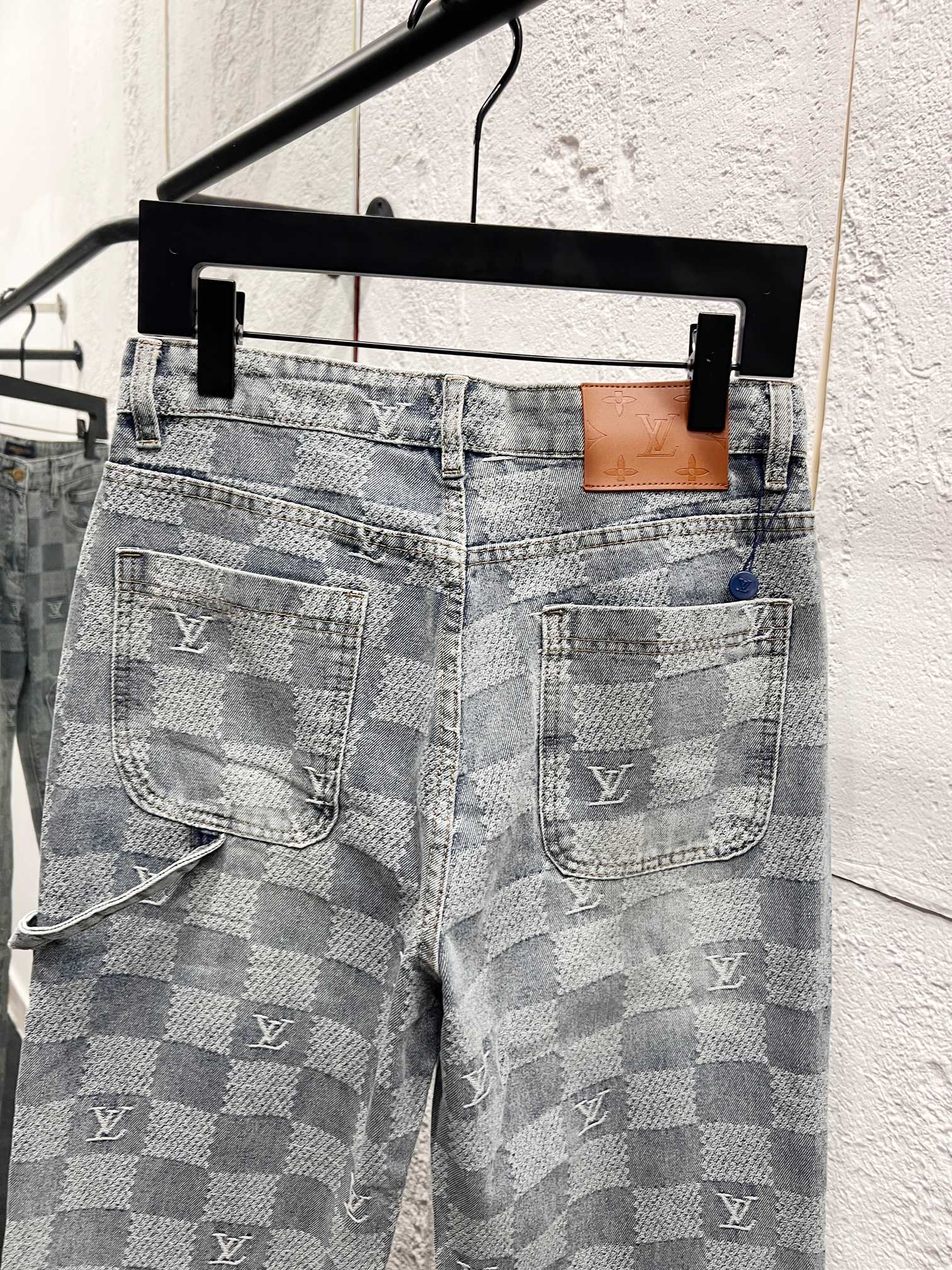 Louis Vuitton monogram jeans back view with dual patch pockets and logo markings