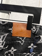 Louis Vuitton pants waist tag and button detail, dark denim with white monogram print