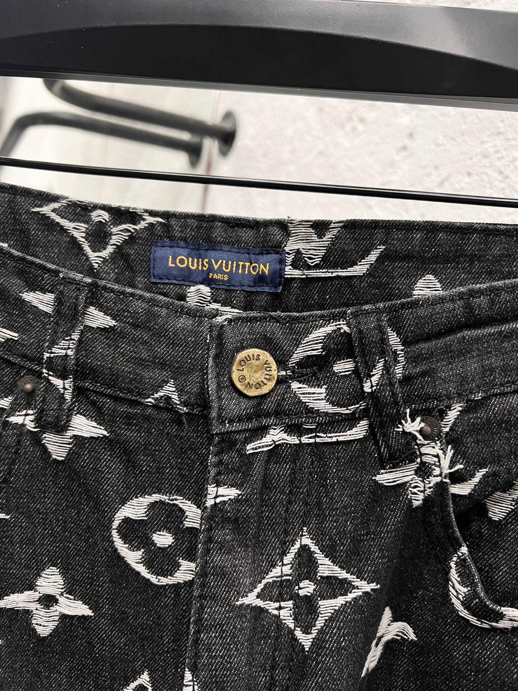 Louis Vuitton pants waistband with blue tag and button, dark denim with white monograms