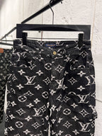 Louis Vuitton monogram print jeans front view, dark denim with white scattered logos