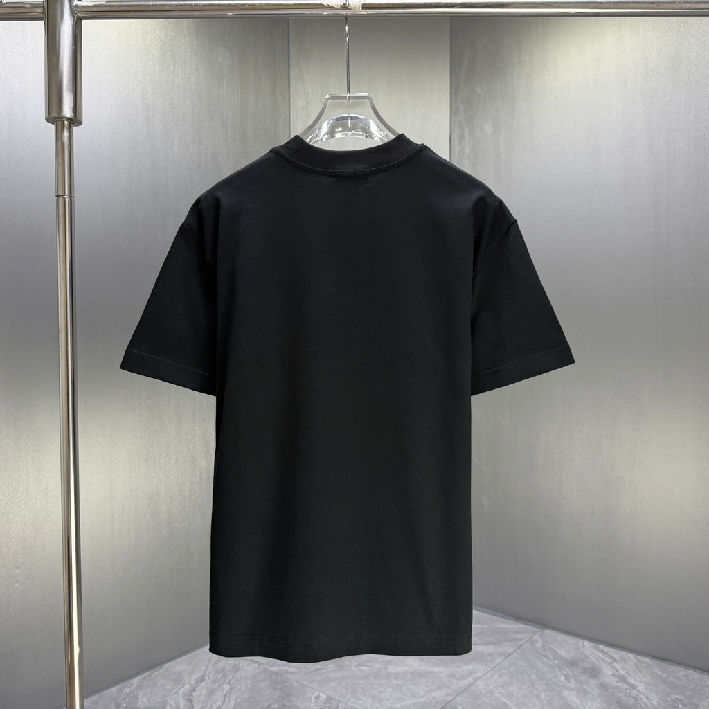Black Gucci short-sleeve T-shirt with plain back, hanging on a store display hook
